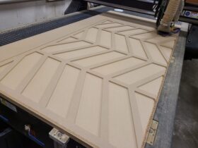Wishbone pattern cnc router machined into MDF wood showing a decorative architectural pattern
